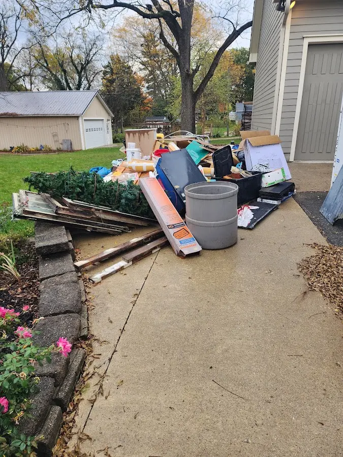 Dumpster being loaded with debris for 30 Yard Dumpster Rental in Brookings